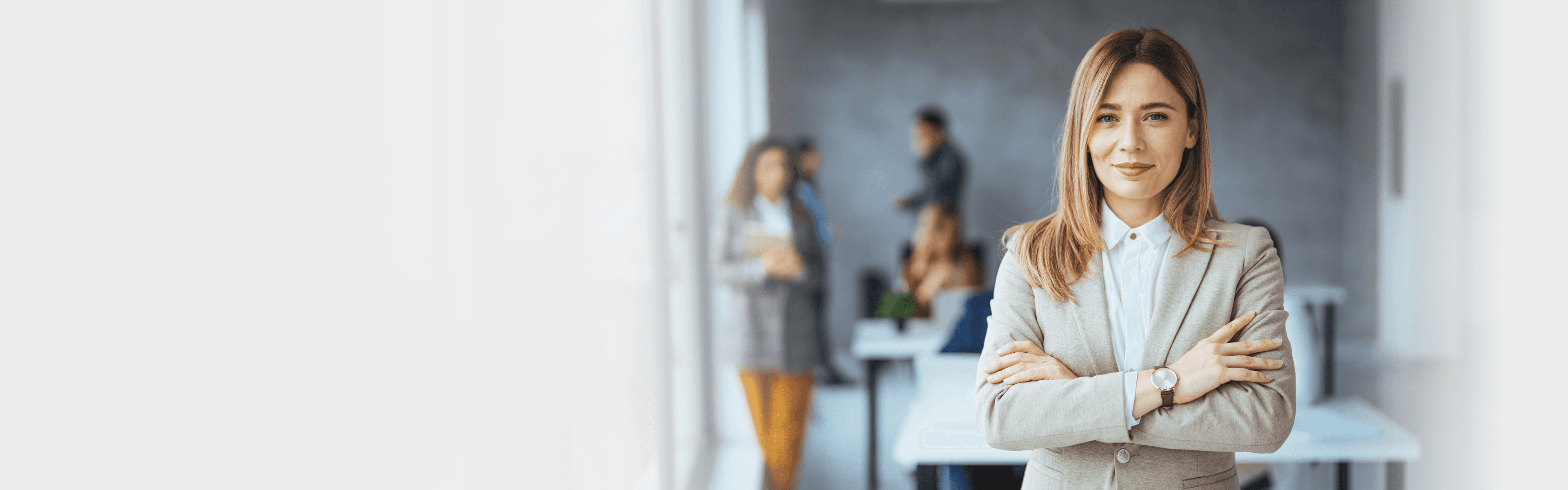 Portrait of beautiful businesswoman standing in front of business team.