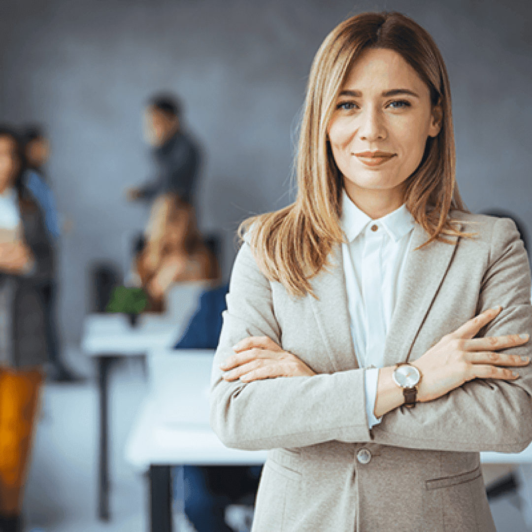 Portrait of beautiful businesswoman standing in front of business team.