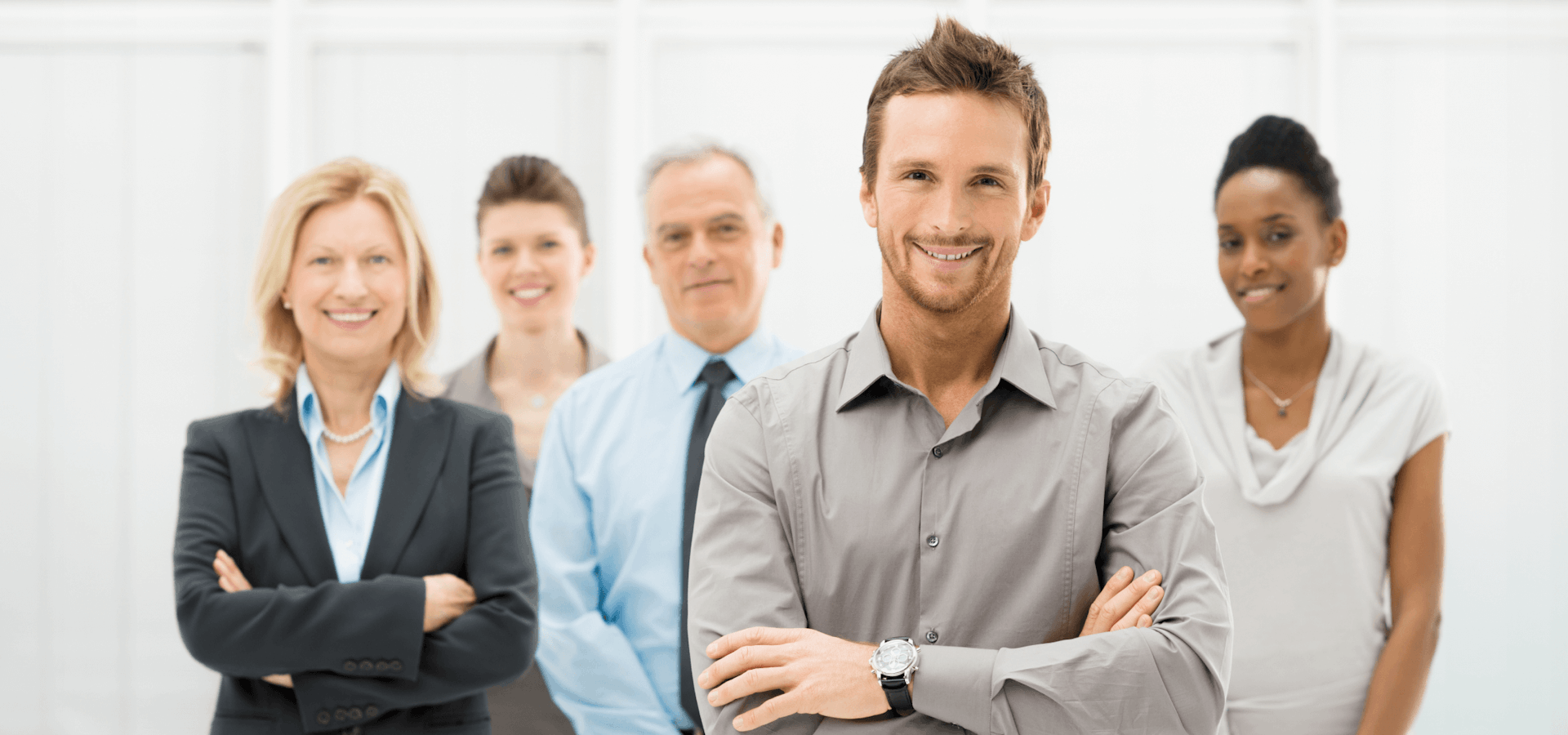 Portrait of a young businessman with a business team